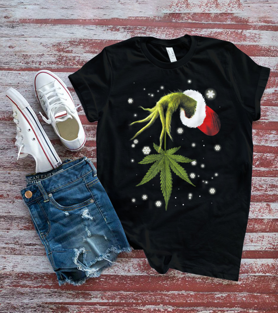Grinch Hand Holding Cannabis Leaf With Santa Hat And Snowflakes T-Shirt