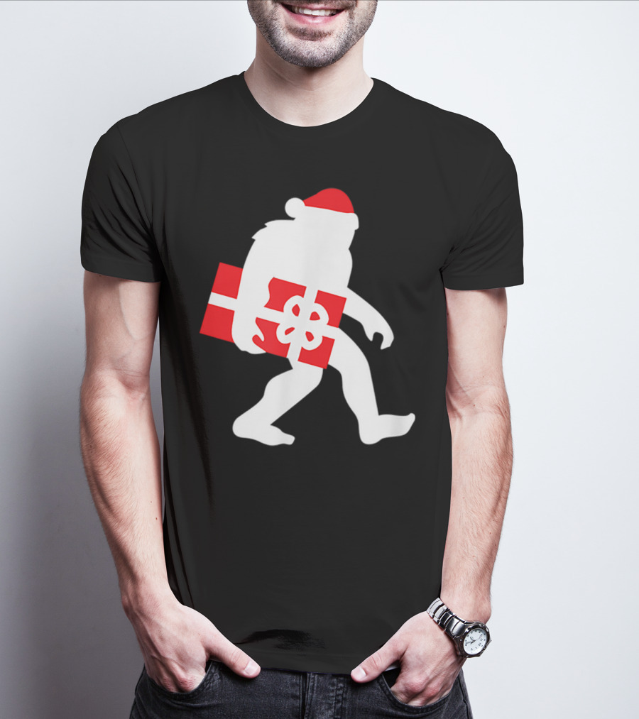 Nice Bigfoot Carrying Christmas Gift In Santa Hat T-Shirt