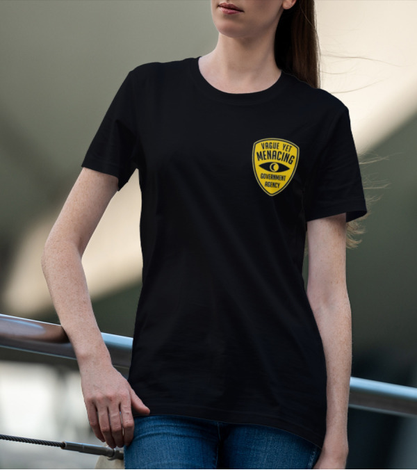 Vague Yet Menacing Government Agency Yellow Badge With Eye T-Shirt