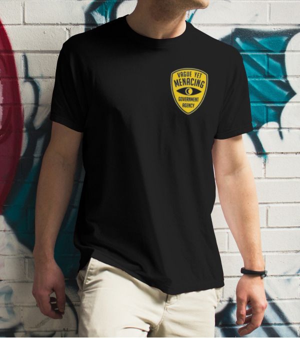 Vague Yet Menacing Government Agency Yellow Badge With Eye T-Shirt