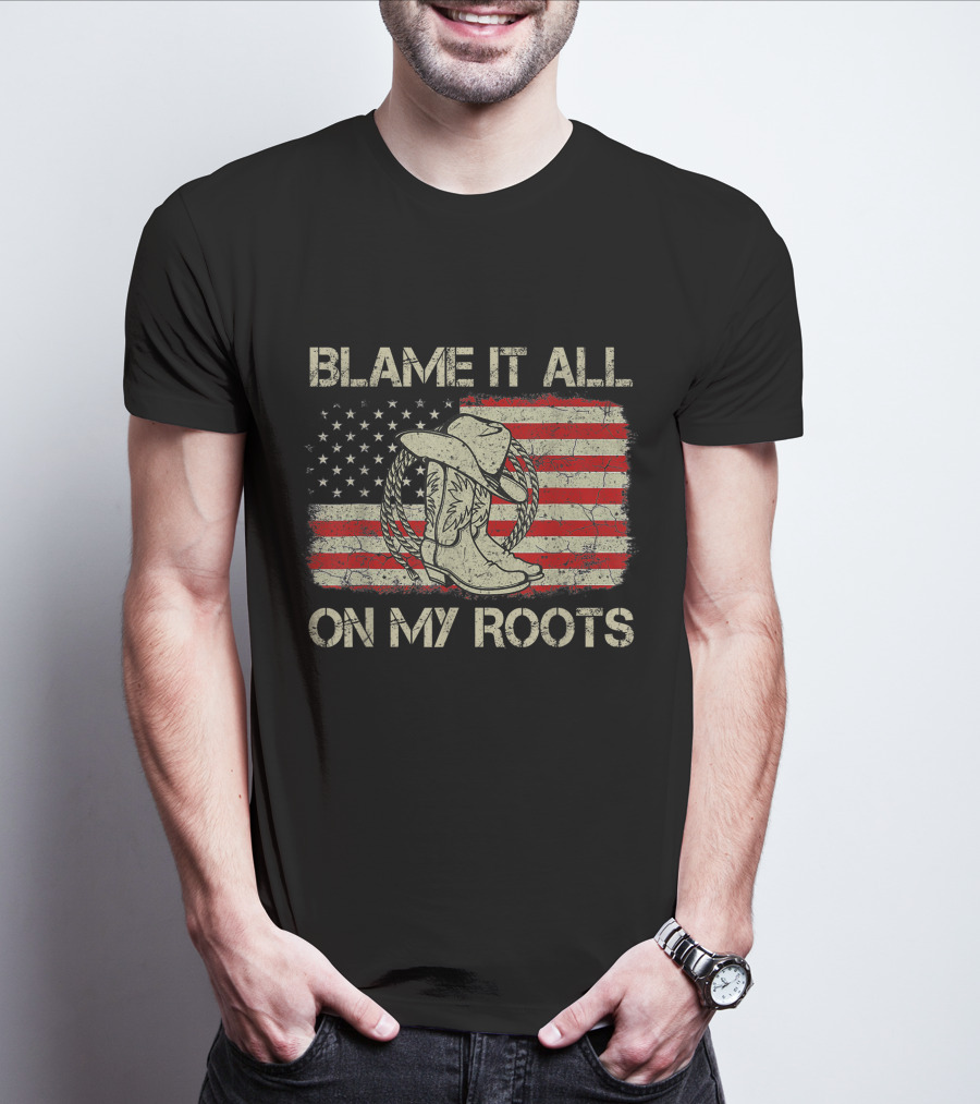 Blame It All On My Roots Cowboy Hat Boots American Flag Background T-Shirt