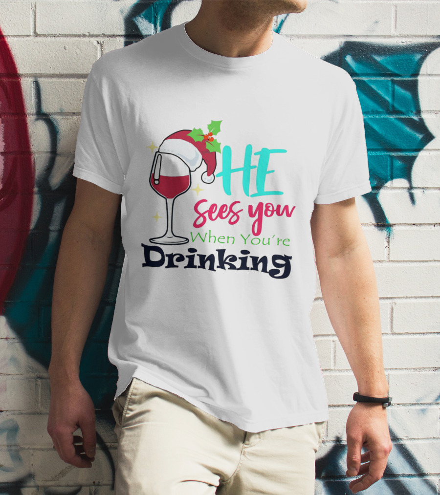 Santa Hat On Wine Glass With 'He Sees You When You're Drinking' Christmas Festive T-Shirt