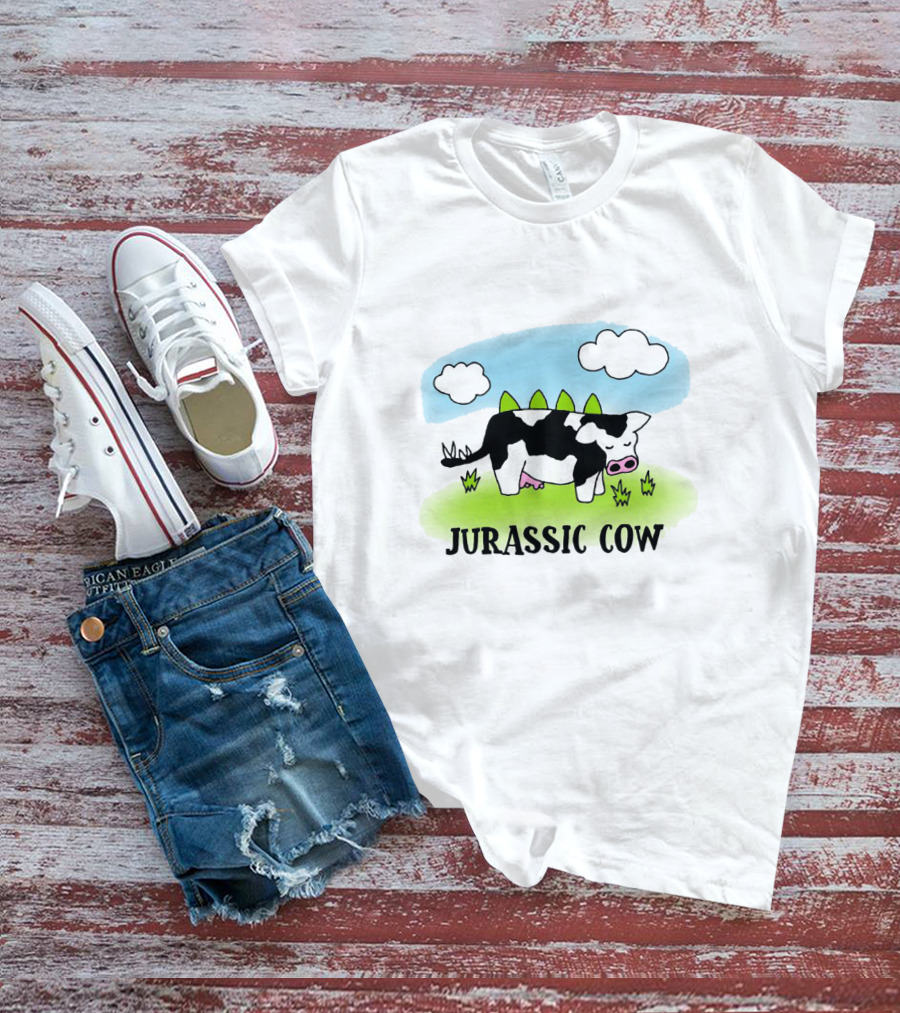 Jurassic Cow Grazing With Dinosaur Spikes Under Blue Sky And Clouds In Cartoon T-Shirt