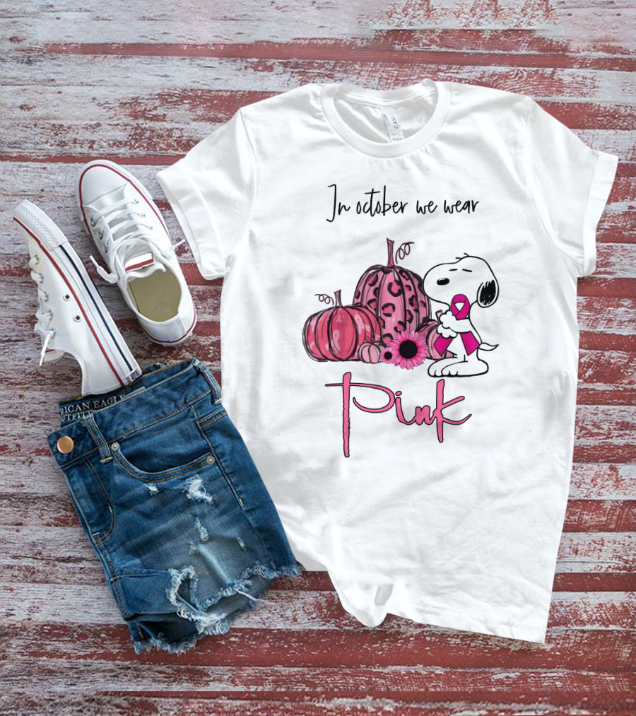 In October We Wear Pink With Peanuts Character Holding Ribbon And Pumpkins T-Shirt