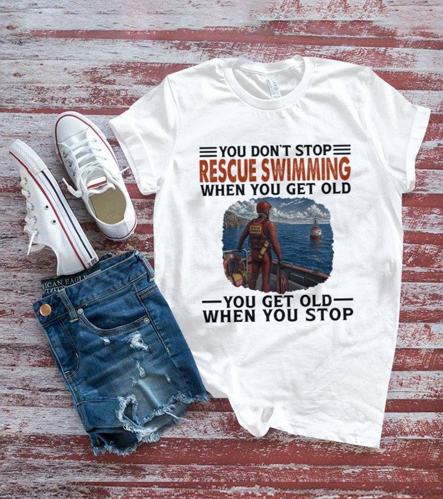 You Don't Stop Rescue Swimming When You Get Old You Get Old When You Stop Rescue Swimmer Standing On Boat Near Lighthouse T-Shirt