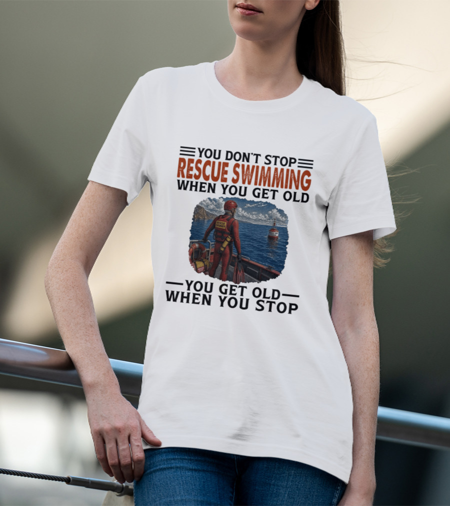 You Don't Stop Rescue Swimming When You Get Old You Get Old When You Stop Rescue Swimmer Standing On Boat Near Lighthouse T-Shirt