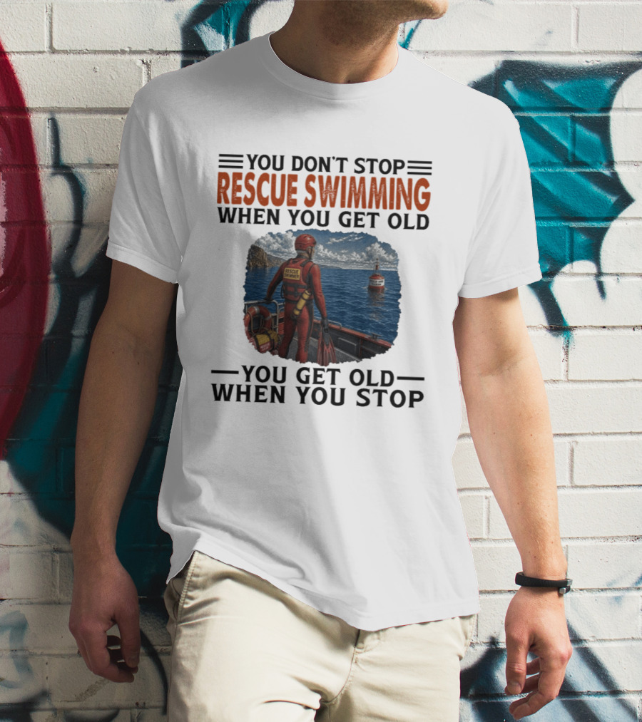 You Don't Stop Rescue Swimming When You Get Old You Get Old When You Stop Rescue Swimmer Standing On Boat Near Lighthouse T-Shirt