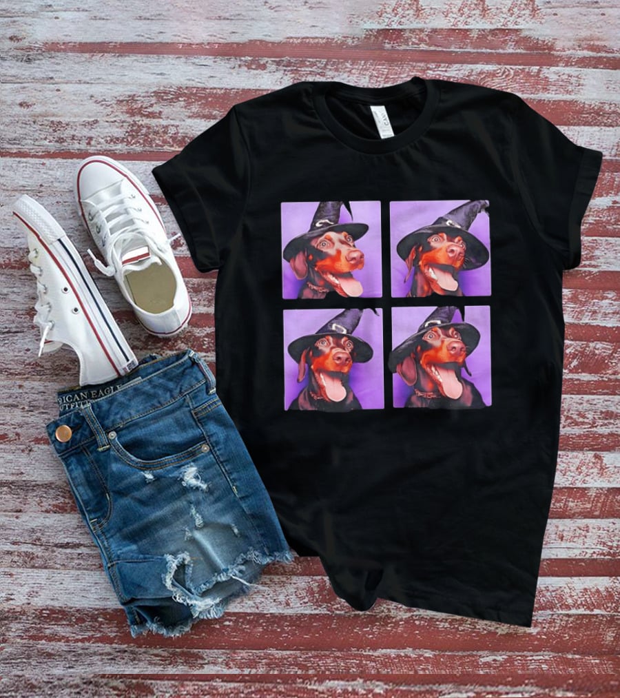 Doberman Pinscher In Witch Hat For Halloween With Purple T-Shirt