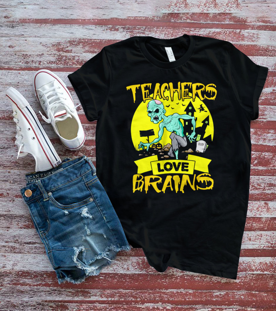 Teachers Love Brains Zombie Halloween Theme With Haunted Houses And Graveyard Background T-Shirt