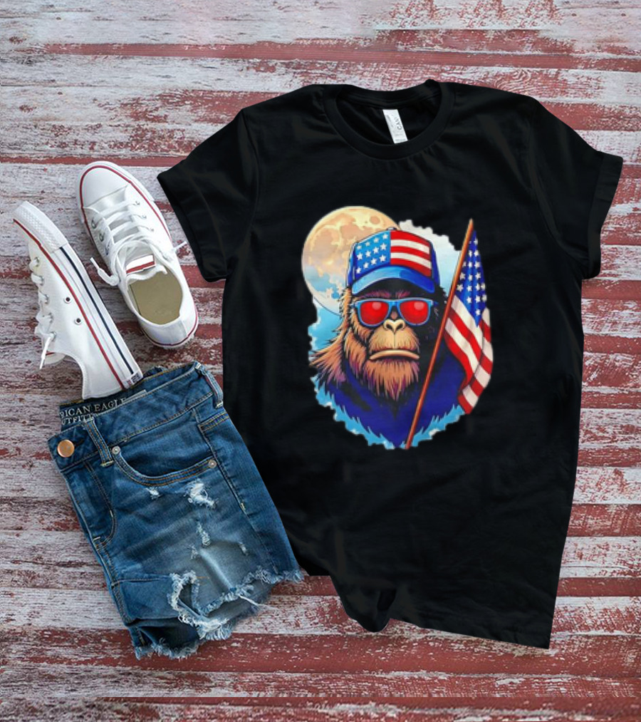 Bigfoot USA Flag Hat Sunglasses Patriotic Moon Background T-Shirt