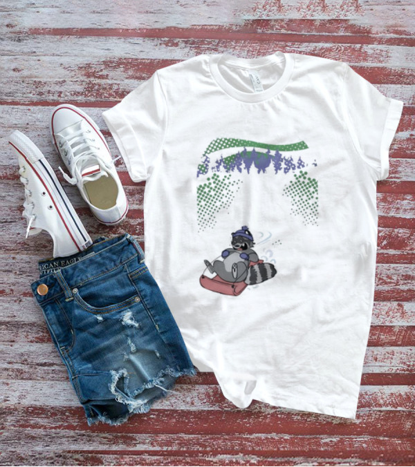 Raccoon Sledding In Winter Forest Scene With Evergreen Trees And Snowflakes T-Shirt