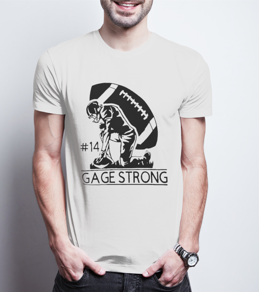 Gage Strong #14 Football Player Kneeling In Front Of Large Football T-Shirt
