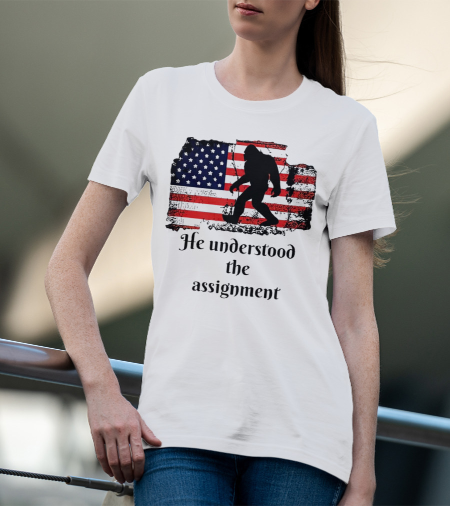 Bigfoot Silhouette With Distressed American Flag He Understood The Assignment T-Shirt