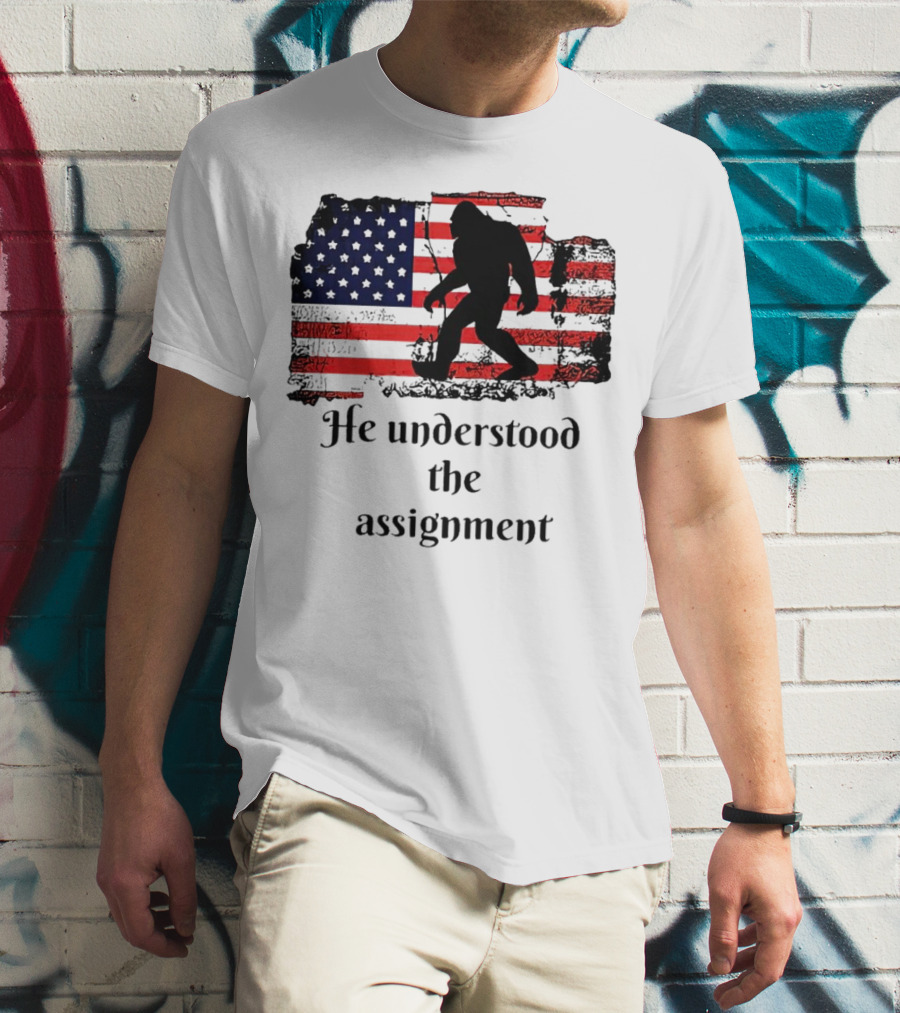 Bigfoot Silhouette With Distressed American Flag He Understood The Assignment T-Shirt