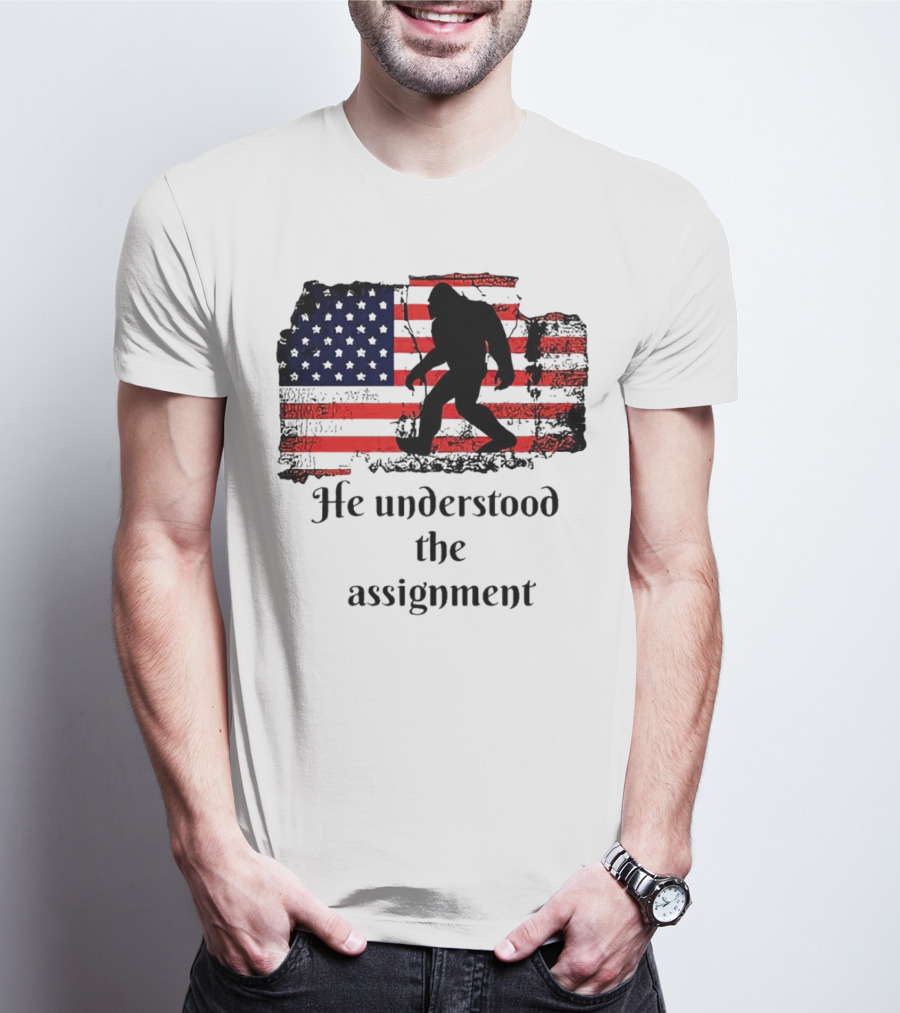 Bigfoot Silhouette With Distressed American Flag He Understood The Assignment T-Shirt