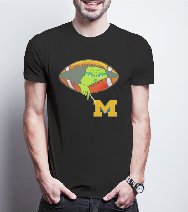 Grinch Peeking From Football Over Michigan Wolverines T-Shirt