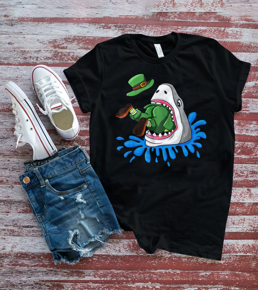 Shark Devours Leprechaun Wearing Green Outfit With Dropped Hat In Water Splash T-Shirt