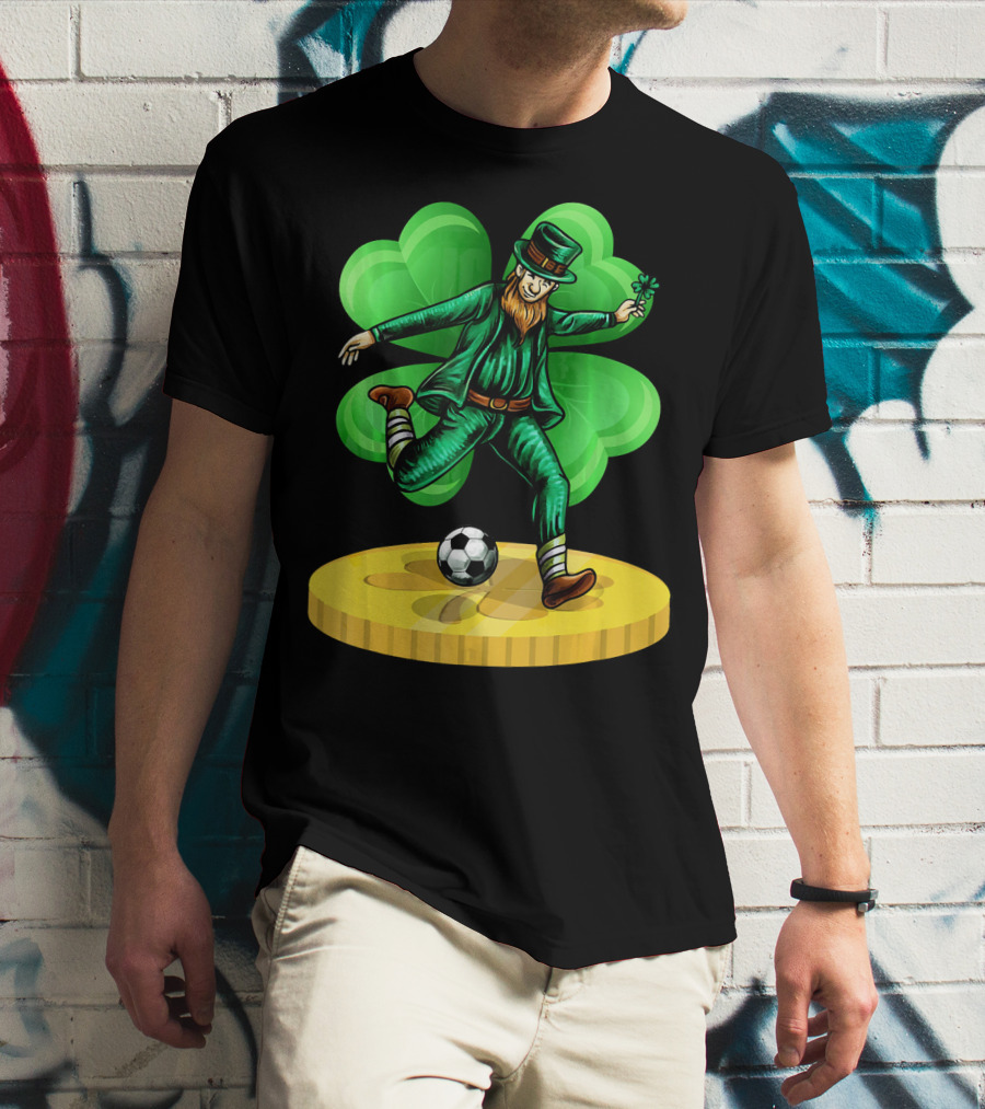 Leprechaun Kicking Soccer Ball On Gold Coin With Shamrock Background T-Shirt