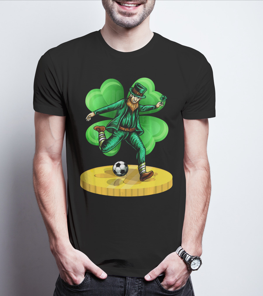 Leprechaun Kicking Soccer Ball On Gold Coin With Shamrock Background T-Shirt