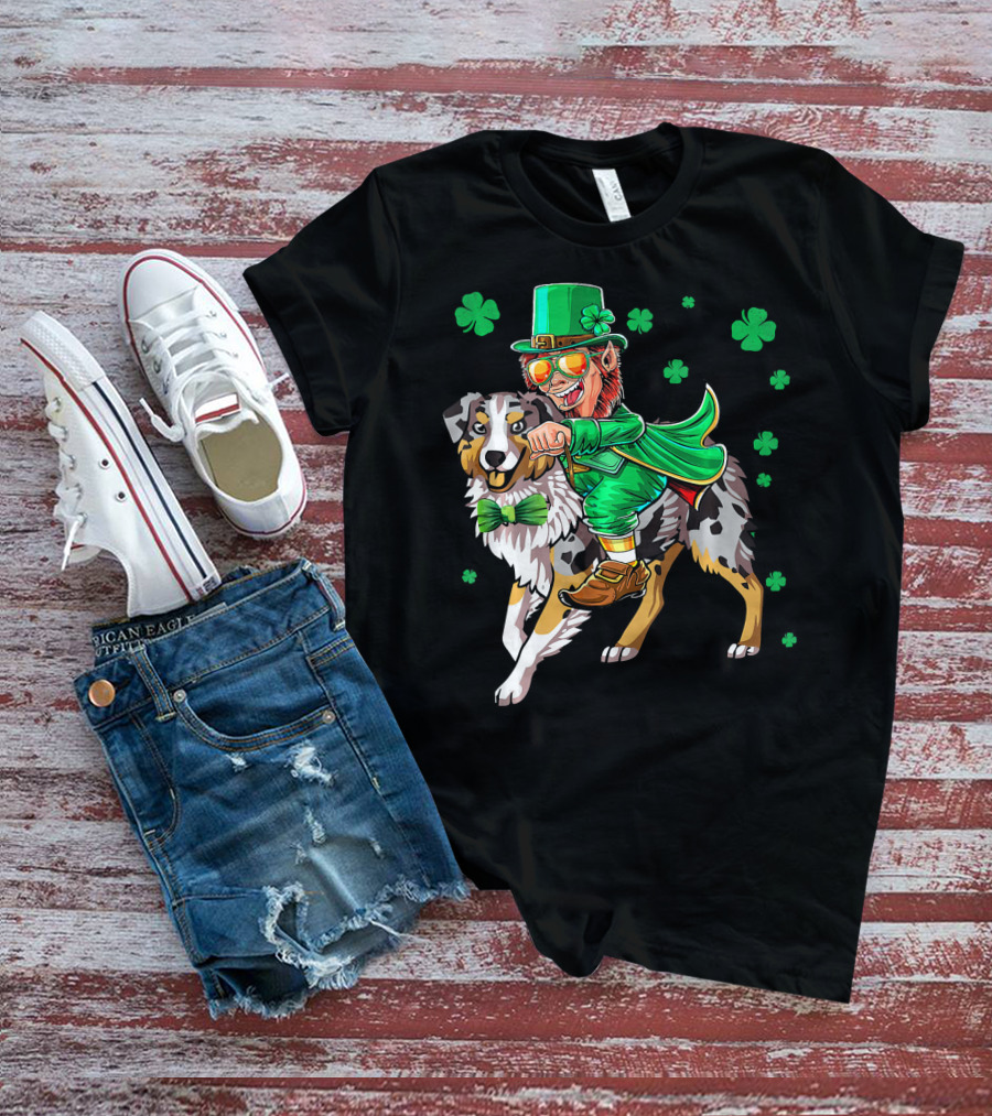 Leprechaun Riding Australian Shepherd With Shamrock Bow Tie And Clover Background T-Shirt