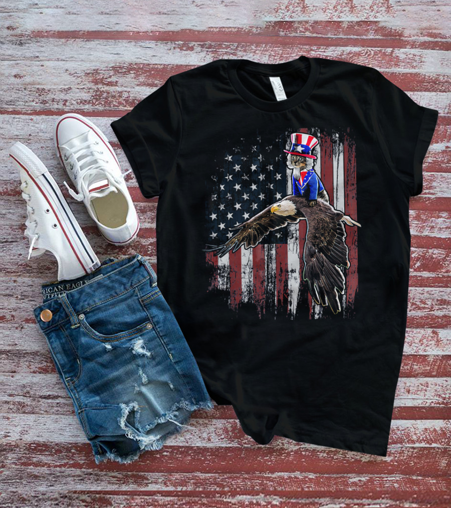 Uncle Sam Costume Cat Riding Bald Eagle On American Flag Background T-Shirt