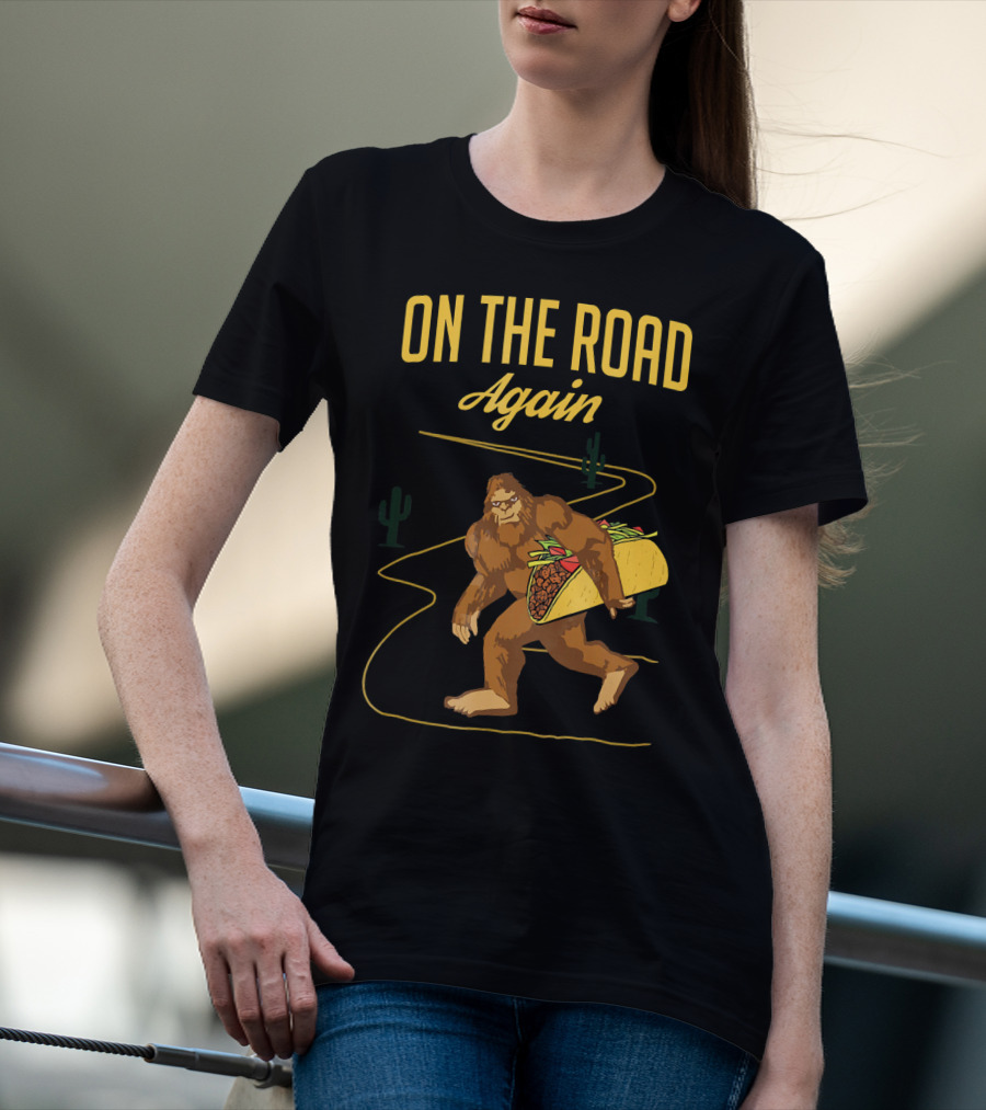 ON THE ROAD AGAIN Smirk Bigfoot Sasquatch Carrying Taco T-Shirt