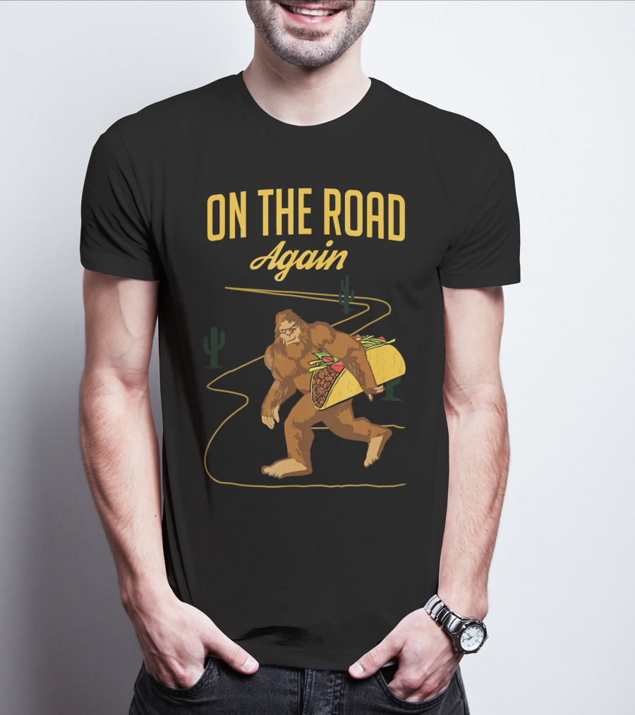 ON THE ROAD AGAIN Smirk Bigfoot Sasquatch Carrying Taco T-Shirt