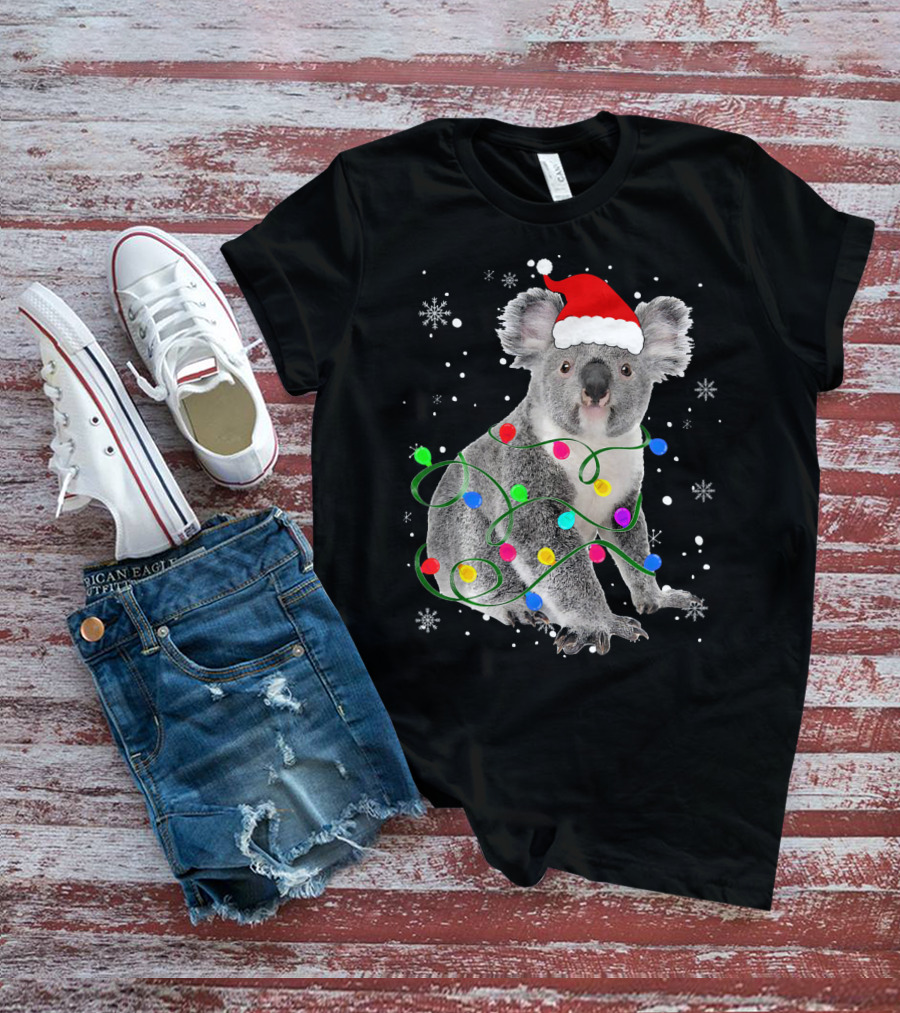 Koala Wrapped In Christmas Lights Wearing Santa Hat With Snowflakes Matching Fam T-Shirt