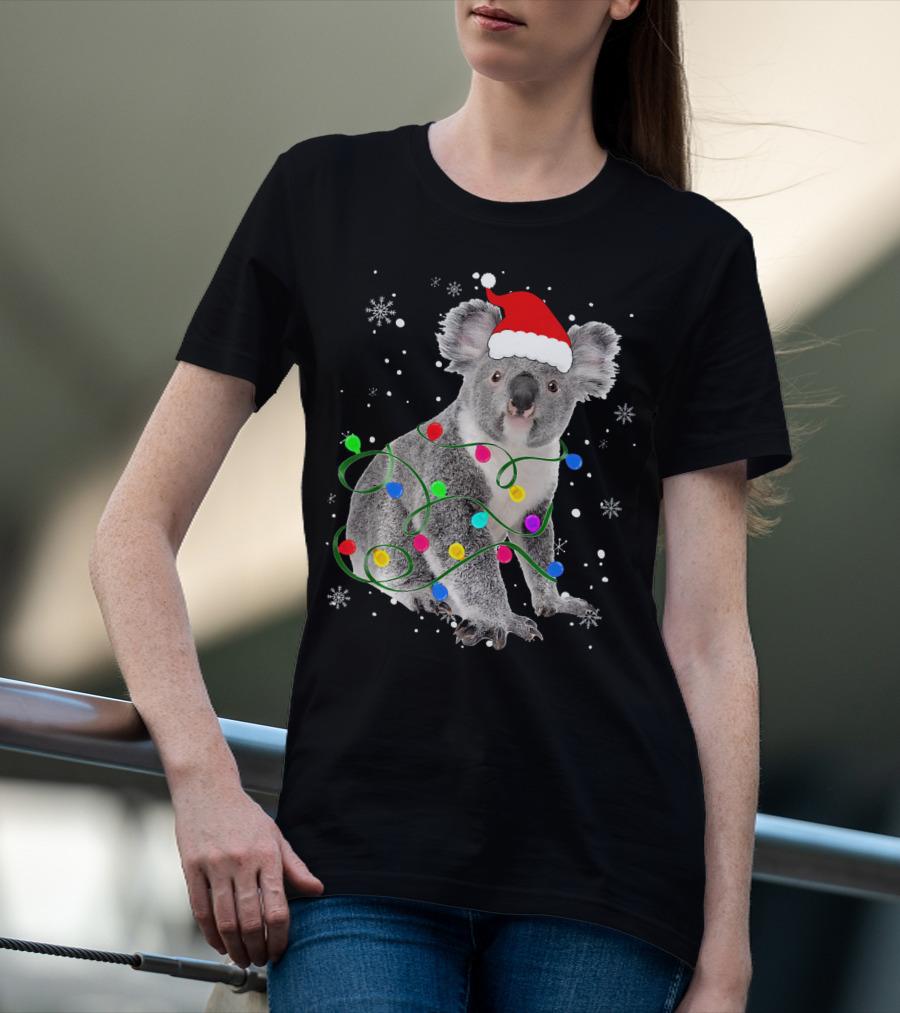Koala Wrapped In Christmas Lights Wearing Santa Hat With Snowflakes Matching Fam T-Shirt