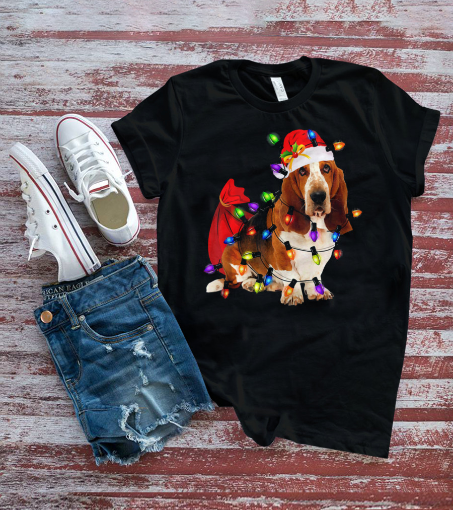 Basset Hound Wrapped In Christmas Lights With Santa Hat And Red Sack T-Shirt