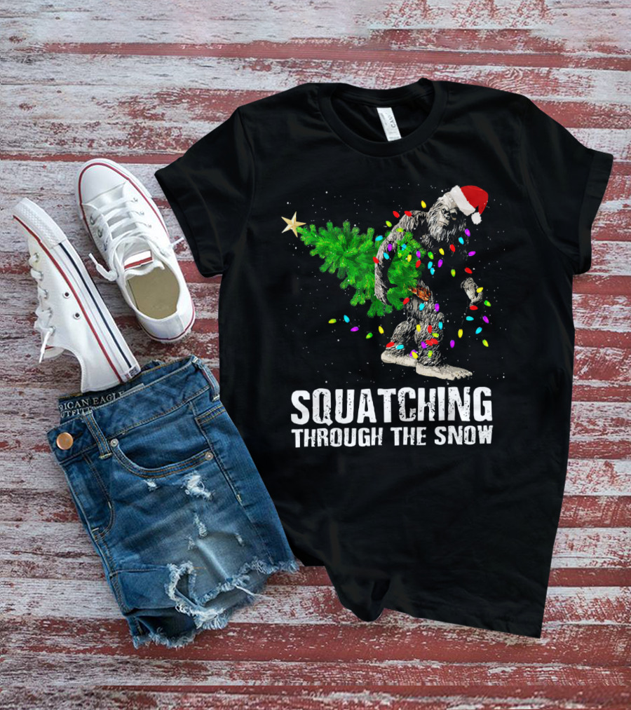 Squatching Through The Snow Bigfoot Christmas Lights Santa Hat T-Shirt