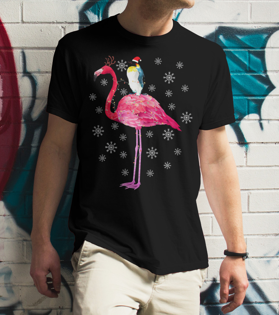 Penguin With Santa Hat Riding Flamingo With Antlers Surrounded By Snowflakes T-Shirt