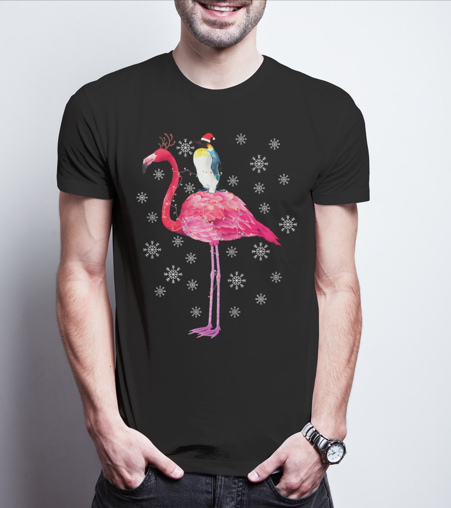 Penguin With Santa Hat Riding Flamingo With Antlers Surrounded By Snowflakes T-Shirt