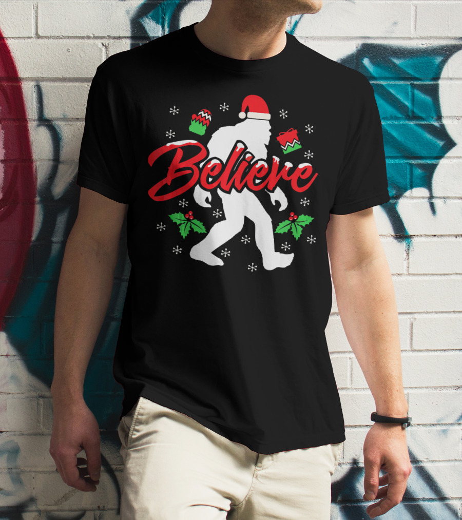 Believe Bigfoot Christmas Santa Hat Snowflakes Holly T-Shirt