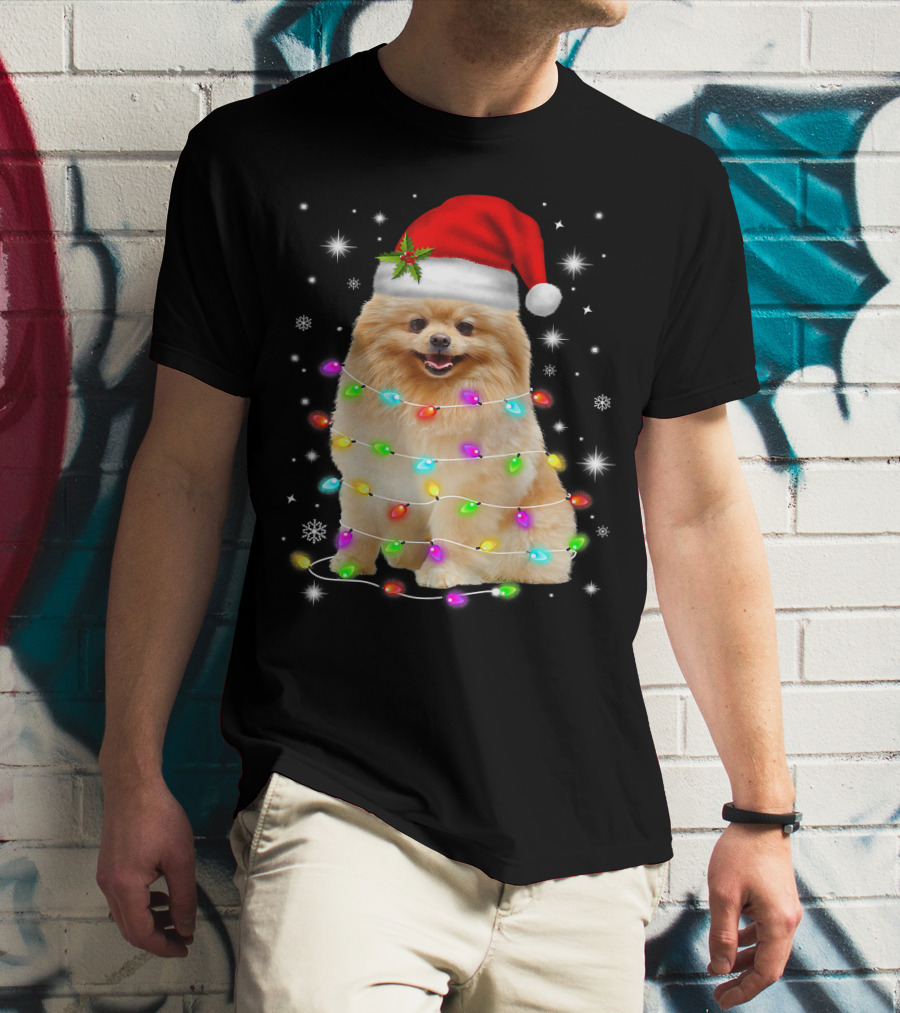 Pomeranian Pup Wrapped In Christmas Lights With Santa Hat And Festive Glow T-Shirt